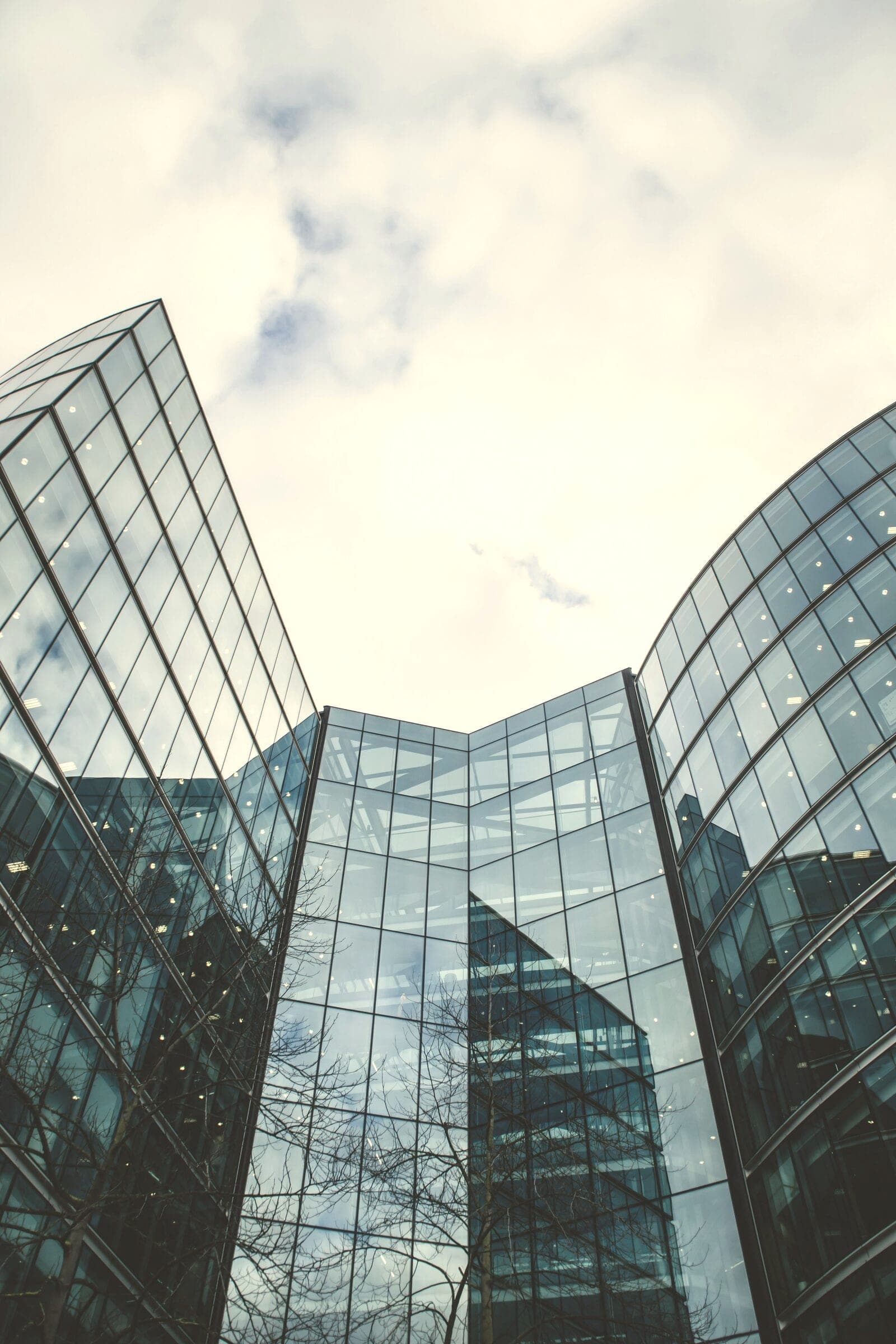 Curved glass towers seen from below
